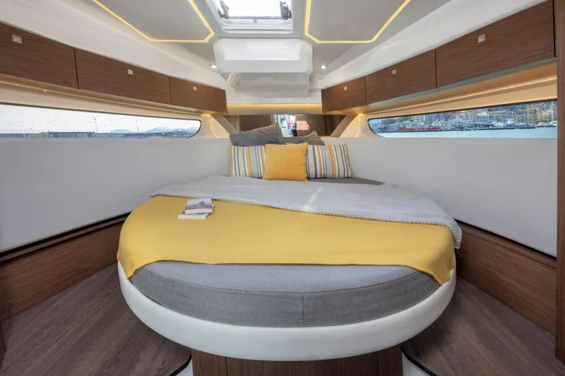 Slide: The Image of Luxurious cabin interior of 2020 Jeanneau NC 1095 Fly with cozy bed and modern design. - 12