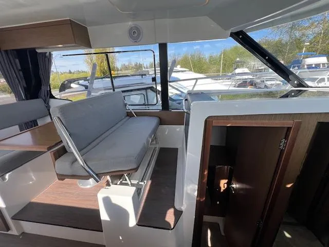 Slide: The Image of Interior of 2020 Jeanneau NC 1095 Fly boat with seating and window view. - 26