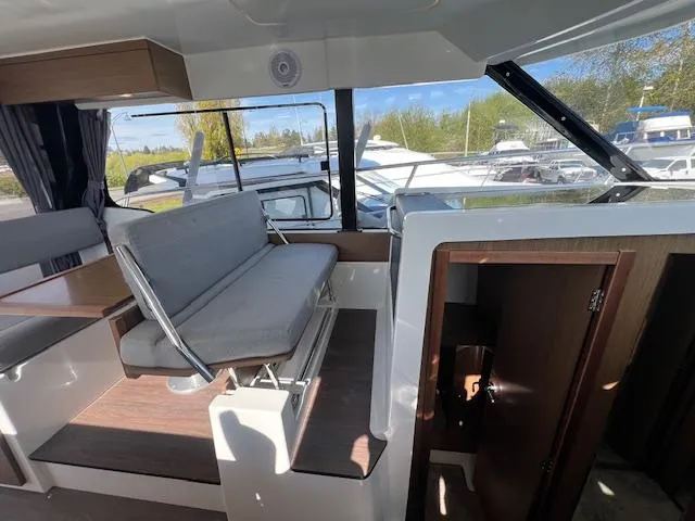 Slide: The Image of Interior of 2020 Jeanneau NC 1095 Fly boat with seating and windows. - 27