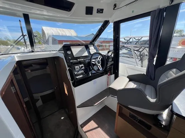 Slide: The Image of 2020 Jeanneau NC 1095 Fly cockpit with modern controls and comfortable seating. - 28