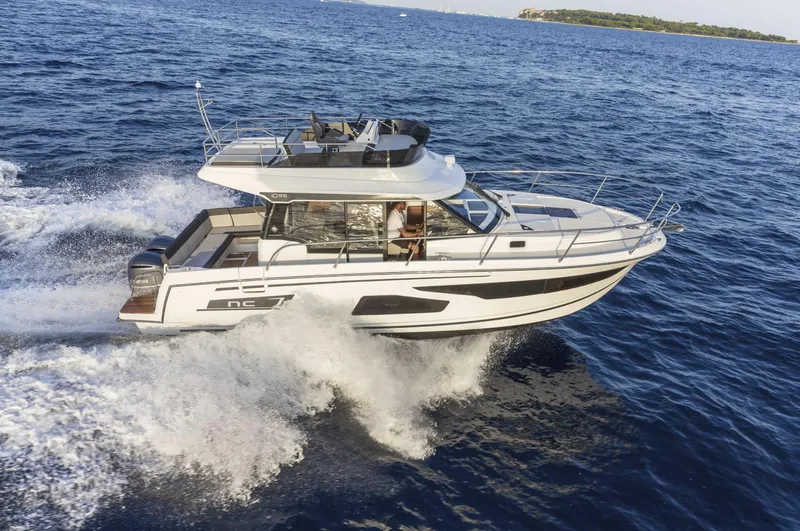 Slide: The Image of 2020 Jeanneau NC 1095 Fly cruising on open water, side view. - 3