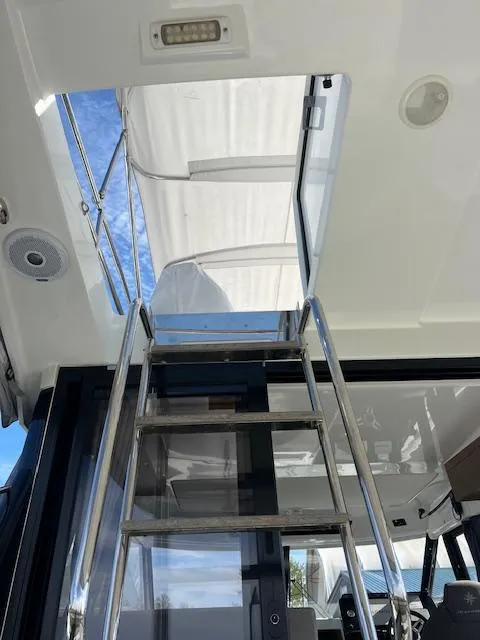 Slide: The Image of Stainless steel ladder leading to flybridge on 2020 Jeanneau NC 1095 Fly yacht. - 33