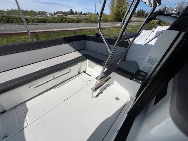 Slide: The Image of 2020 Jeanneau NC 1095 Fly boat interior with seating and ladder. - 39