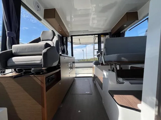 Slide: The Image of Interior of 2020 Jeanneau NC 1095 Fly boat, featuring modern seating and sleek design. - 43