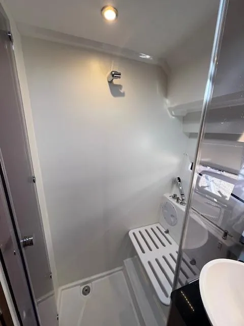 Slide: The Image of Bathroom interior of 2020 Jeanneau NC 1095 Fly yacht, featuring shower and sink. - 45