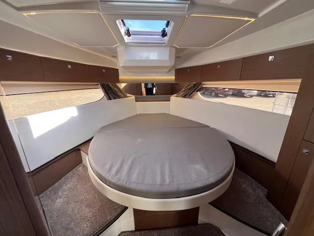 Slide: The Image of Luxurious interior of 2020 Jeanneau NC 1095 Fly with round bed and skylight. - 49