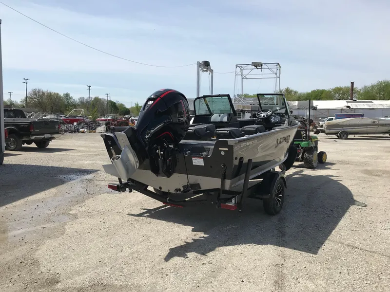 Slide: The Image of 2025 Lund 1875 Impact XS Sport boat in outdoor lot, rear view. - 6
