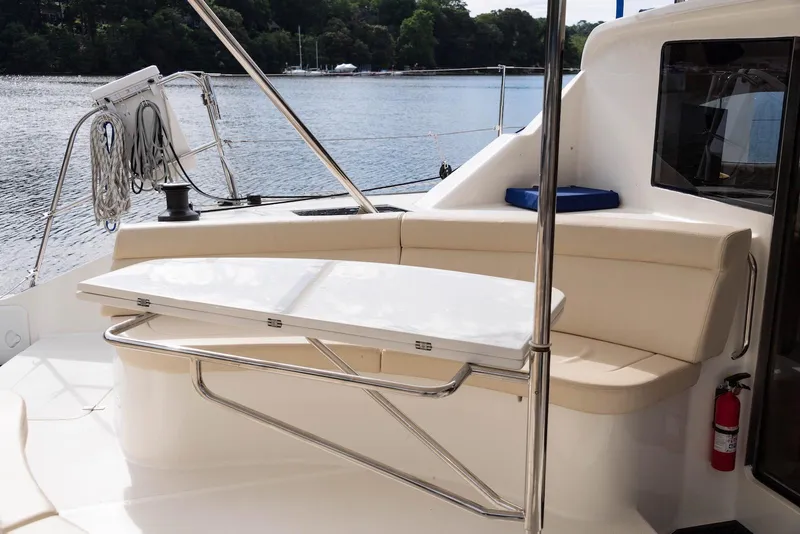 Slide: The Image of Cozy seating area on a 2017 Balance 451 yacht, overlooking serene waters. - 15