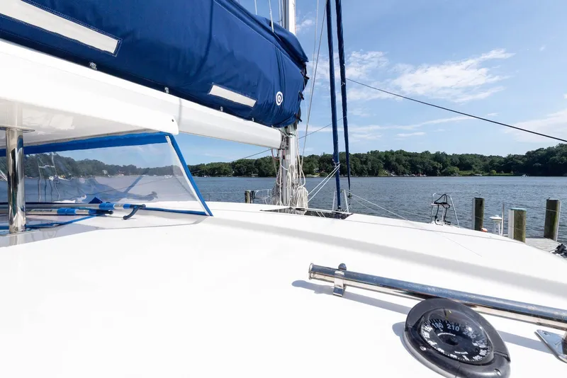 Slide: The Image of Sailboat on a calm lake, Balance 451 model, 2017, with blue sail cover. - 17