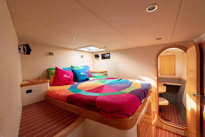 Slide: The Image of Luxurious cabin interior of 2017 Balance 451 yacht with colorful bedding and wooden accents. - 18