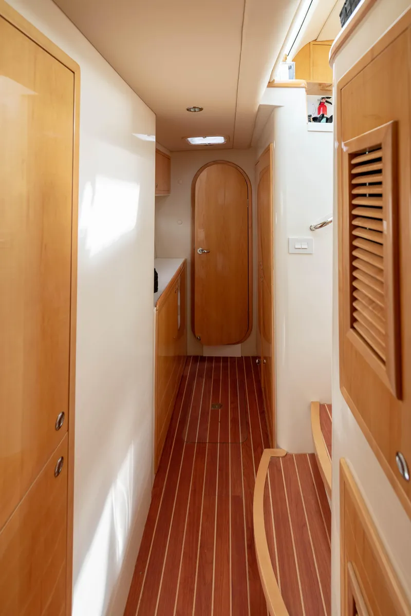 Slide: The Image of Interior hallway of a 2017 Balance 451 yacht, featuring wooden finishes and modern design. - 19