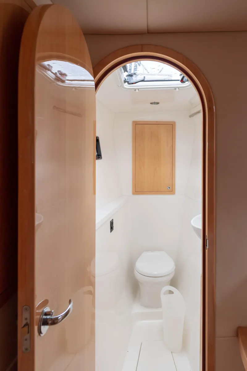 Slide: The Image of Compact bathroom in 2017 Balance 451 yacht with modern fixtures and wooden accents. - 22