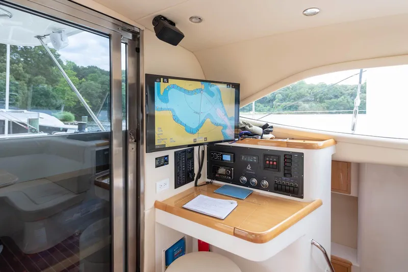 Slide: The Image of Navigation station on a 2017 Balance 451 yacht with map display and control panel. - 31