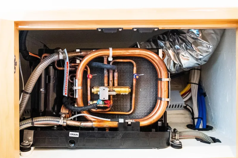 Slide: The Image of Copper piping system inside a Balance 451 model, 2017, with insulation and wiring. - 34