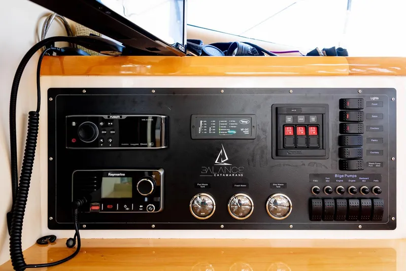 Slide: The Image of Control panel of a 2017 Balance 451 catamaran with navigation and communication equipment. - 36