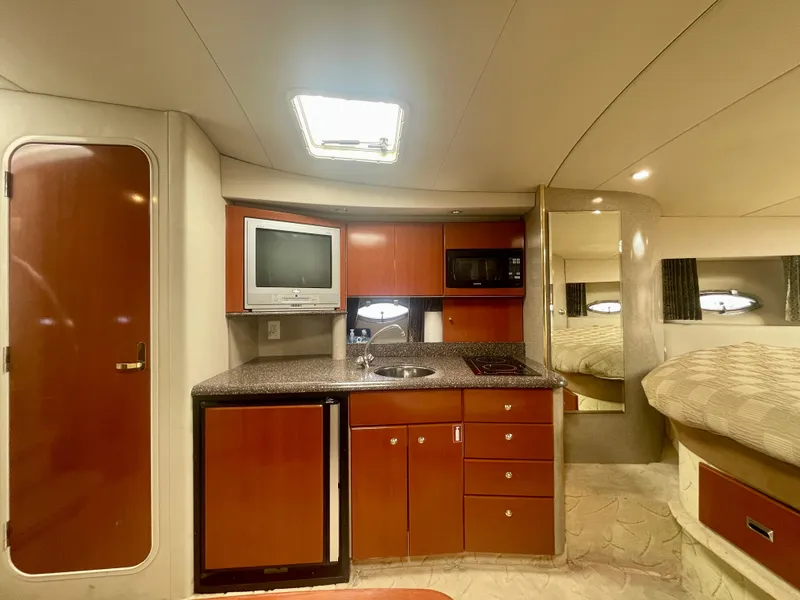 Slide: The Image of Interior of a 2004 Formula 37 PC yacht with kitchenette and cozy sleeping area. - 18