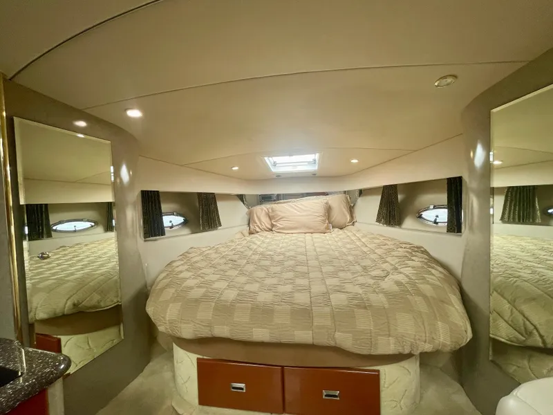 Slide: The Image of Luxurious 2004 Formula 37 PC yacht cabin with cozy bed and elegant mirrors. - 19