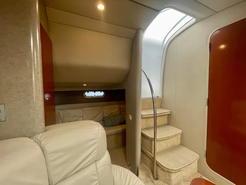 Slide: The Image of Interior of 2004 Formula 37 PC yacht with stairs and cozy seating area. - 20