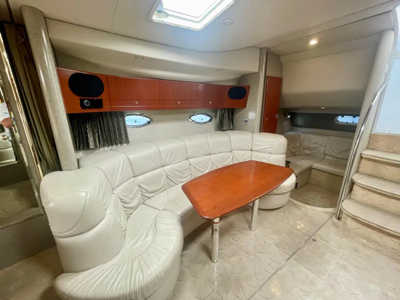Slide: The Image of Luxurious interior of a 2004 Formula 37 PC yacht with plush seating and wooden table. - 21