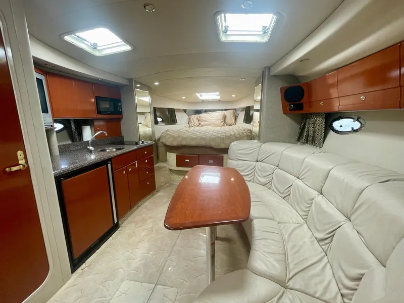 Slide: The Image of 2004 Formula 37 PC yacht interior with kitchen, seating, and bed. Luxurious and spacious design. - 22