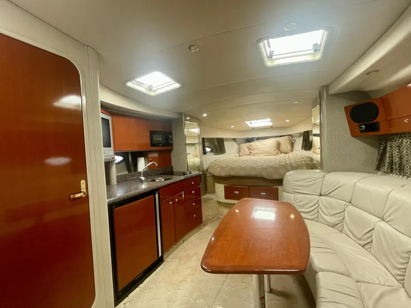 Slide: The Image of Luxurious interior of a 2004 Formula 37 PC yacht with kitchen and seating area. - 23