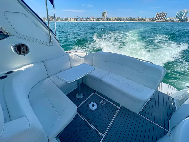 Slide: The Image of 2004 Formula 37 PC yacht with white seating, cruising on open water. - 24