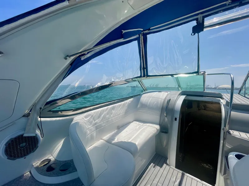 Slide: The Image of 2004 Formula 37 PC yacht interior with white seating and ocean view. - 25