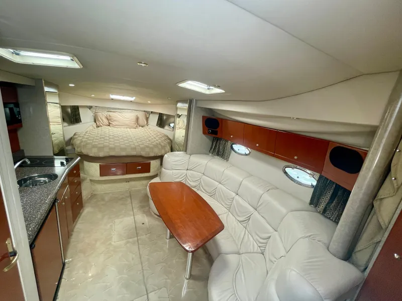 Slide: The Image of 2004 Formula 37 PC yacht interior with cozy seating, kitchenette, and bed. - 27