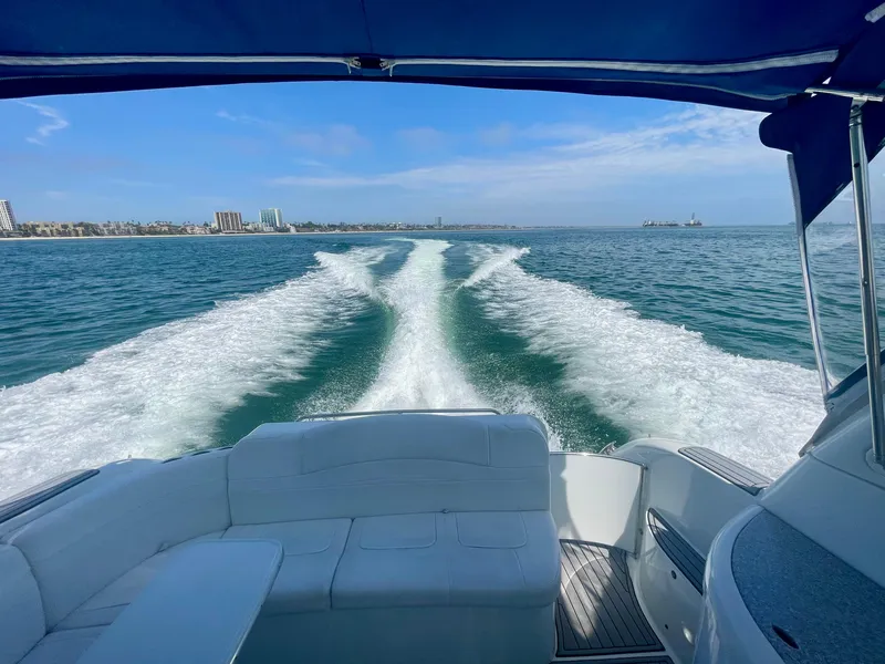 Slide: The Image of 2004 Formula 37 PC yacht cruising on open water, leaving a wake behind. - 28