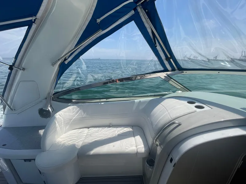 Slide: The Image of 2004 Formula 37 PC yacht interior with white seating and ocean view. - 29