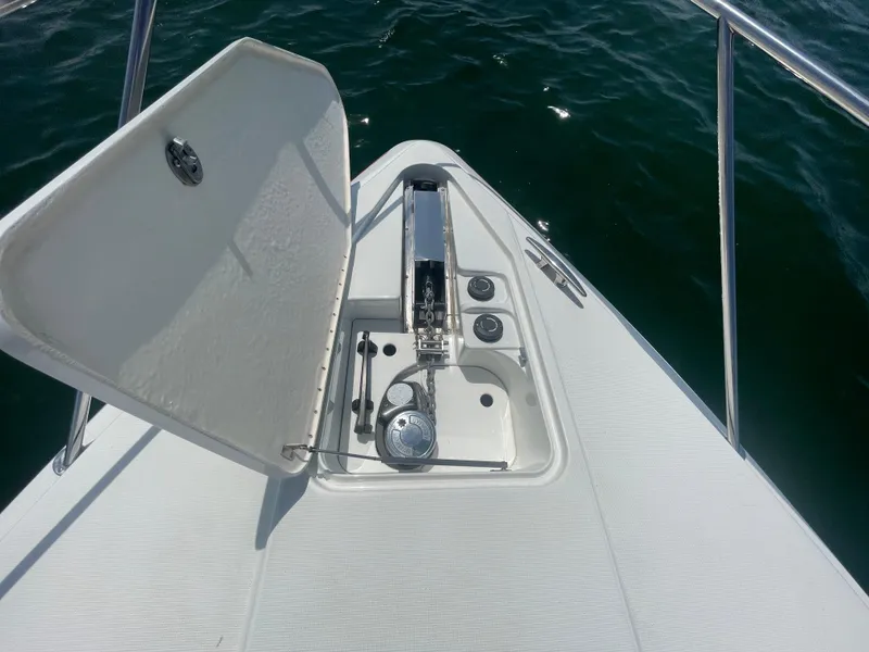Slide: The Image of 2004 Formula 37 PC boat anchor compartment open on calm water. - 32