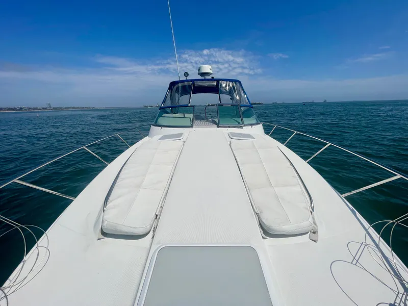 Slide: The Image of 2004 Formula 37 PC yacht on open water, featuring spacious deck and clear blue sky. - 33
