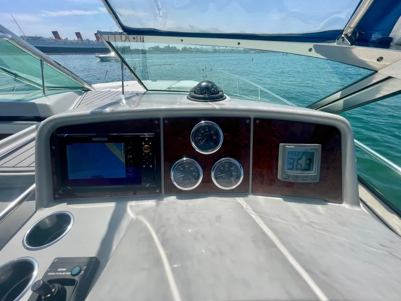 Slide: The Image of Dashboard of a 2004 Formula 37 PC yacht with navigation instruments and sea view. - 40