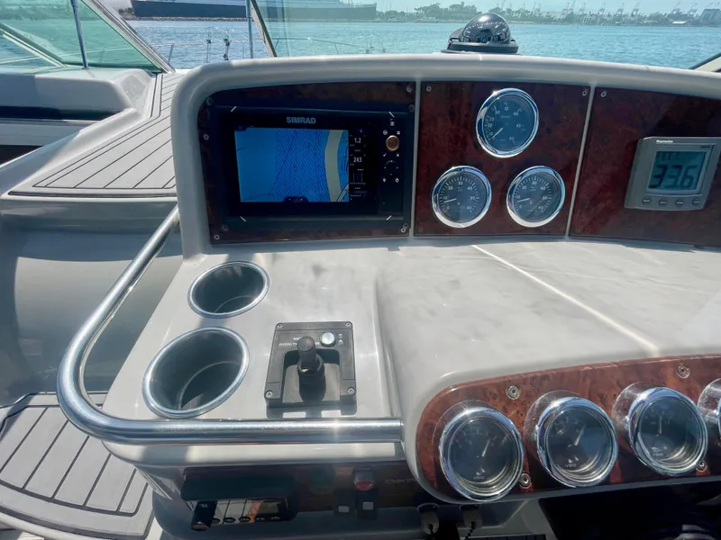Slide: The Image of Dashboard of a 2004 Formula 37 PC boat with navigation instruments and gauges. - 44