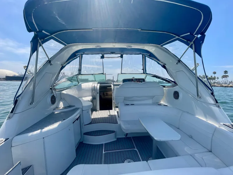 Slide: The Image of 2004 Formula 37 PC yacht interior with blue canopy, spacious seating, and ocean view. - 45