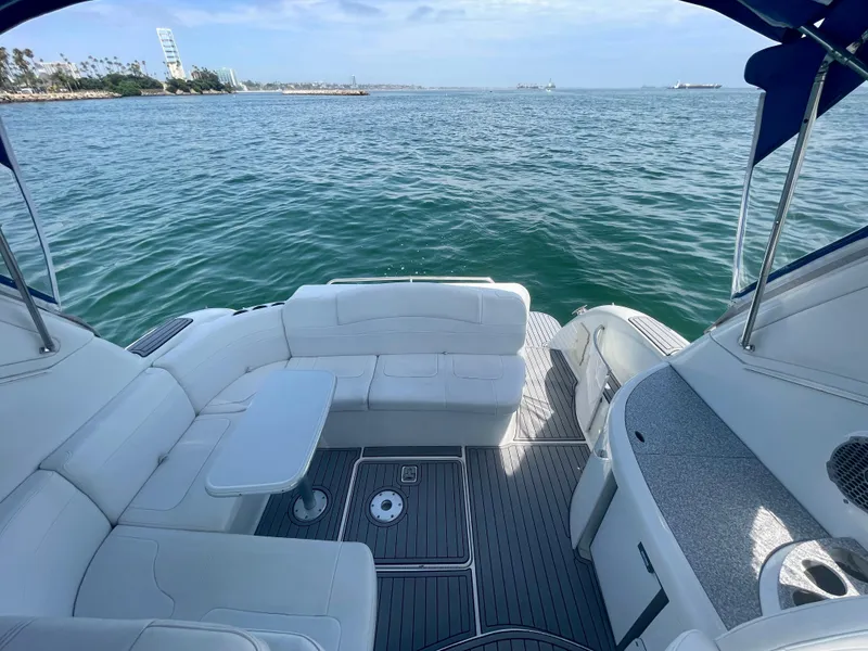 Slide: The Image of 2004 Formula 37 PC yacht interior with ocean view, featuring white seating and table. - 49