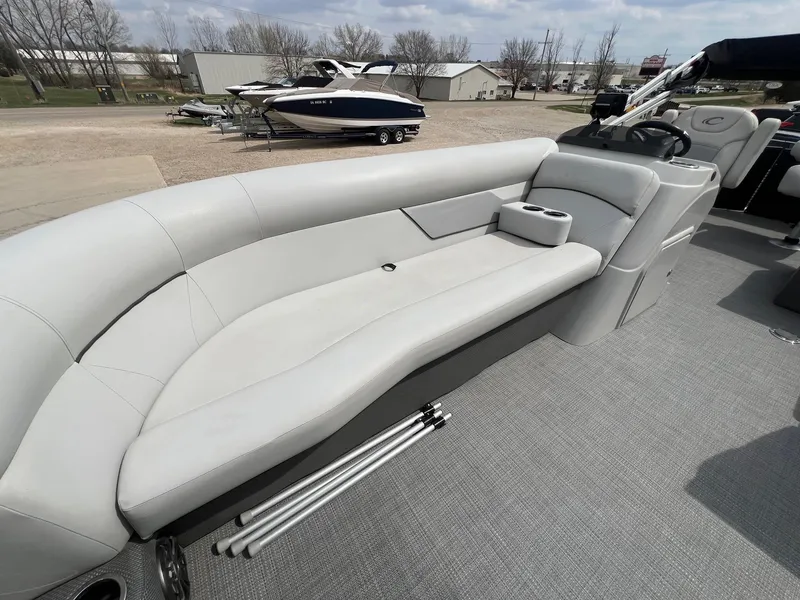 Slide: The Image of 2022 Crest Classic Fish 200 boat interior with gray seating and cup holders. - 12