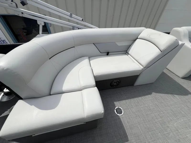 Slide: The Image of Luxurious seating on 2022 Crest Classic Fish 200 pontoon boat, featuring sleek white upholstery. - 19