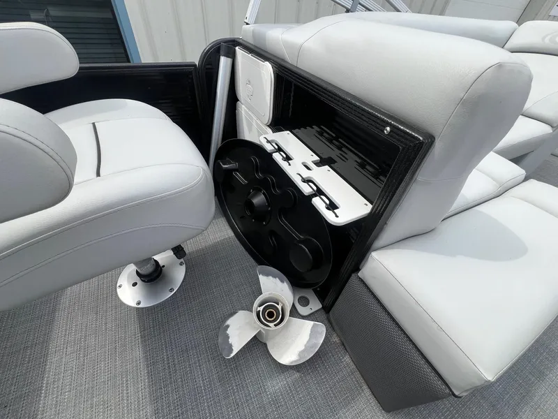 Slide: The Image of 2022 Crest Classic Fish 200 interior with seating and propeller storage. - 22