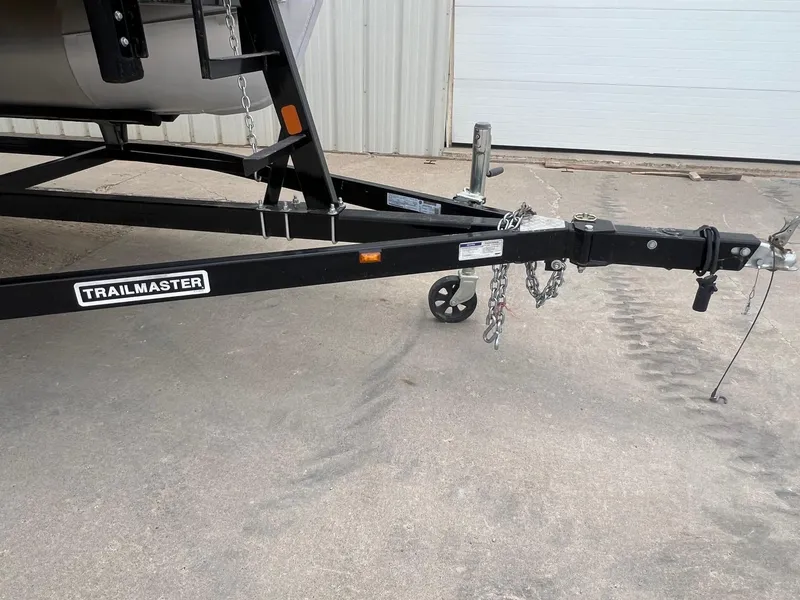 Slide: The Image of Trailer hitch of a 2022 Crest Classic Fish 200, featuring Trailmaster branding. - 24