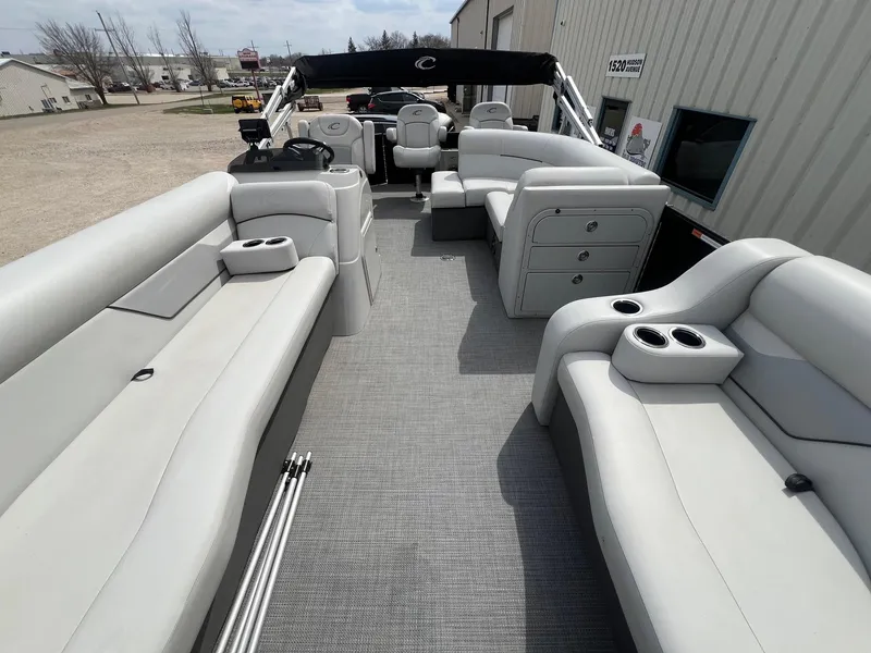 Slide: The Image of 2022 Crest Classic Fish 200 pontoon boat with spacious seating and cup holders. - 7