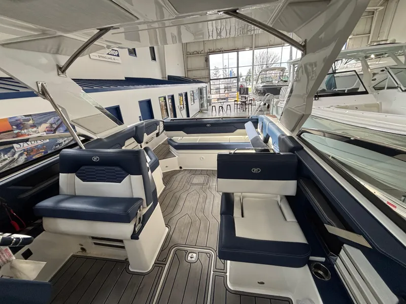 Slide: The Image of 2022 Cobalt A29 boat interior with blue and white seating, spacious layout, and modern design. - 10