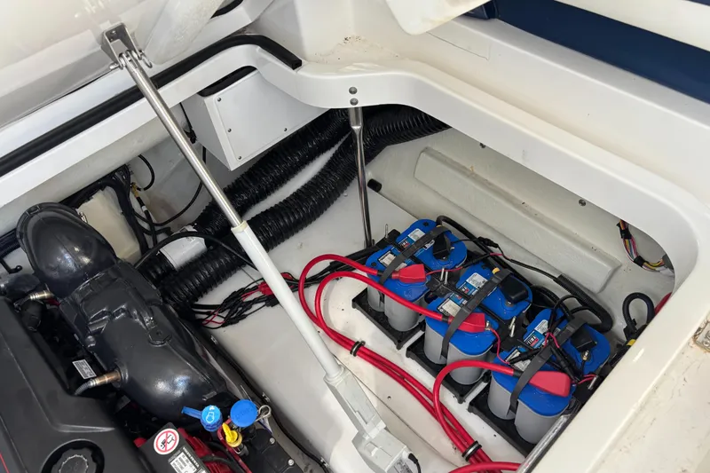 Slide: The Image of 2022 Cobalt A29 boat engine compartment with batteries and wiring. - 11