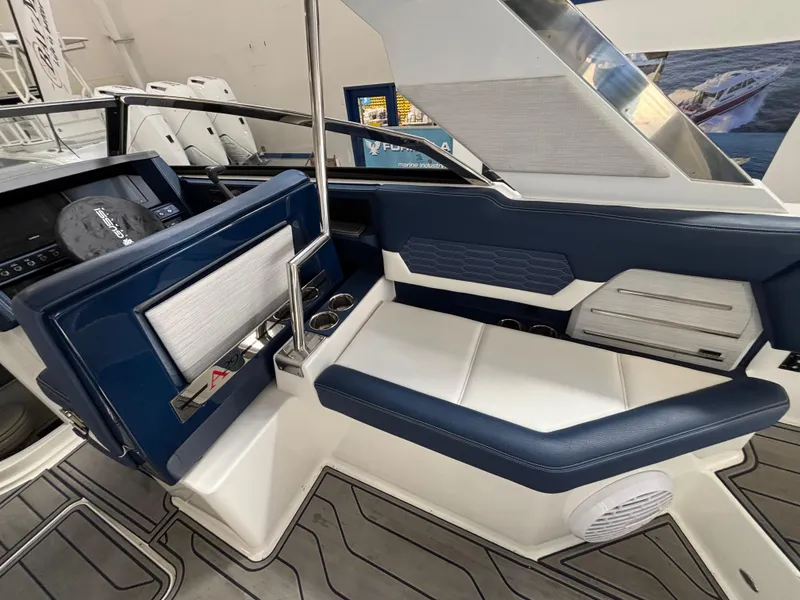 Slide: The Image of Interior of 2022 Cobalt A29 boat with blue and white seating. - 8