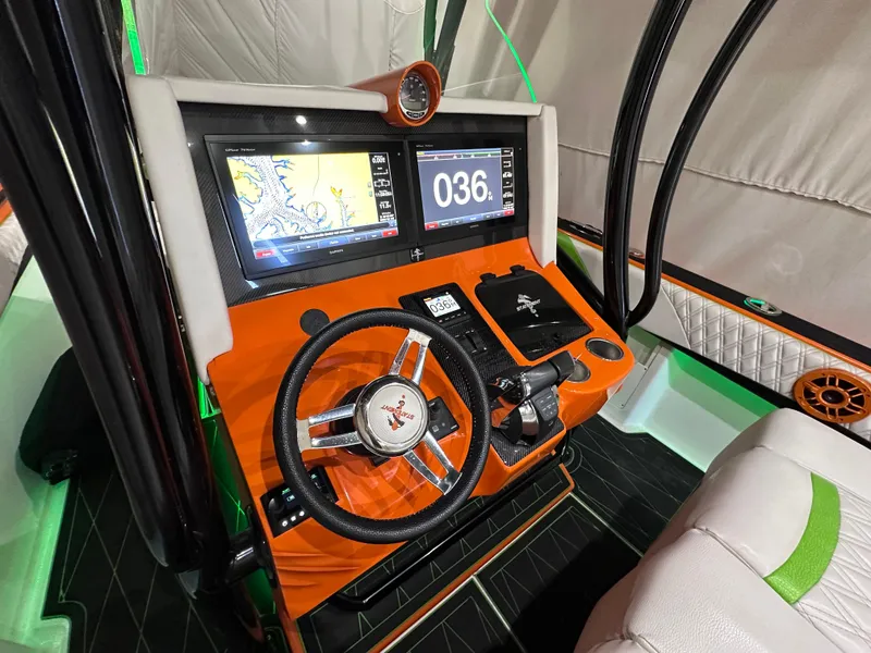 Slide: The Image of 2017 Statement 350 Open boat dashboard with navigation screens and steering wheel. - 10