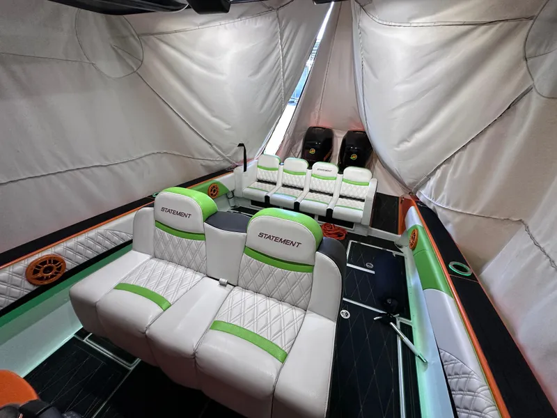 Slide: The Image of Interior of 2017 Statement 350 Open boat with white and green seating. - 11