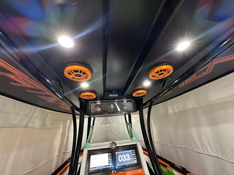 Slide: The Image of Interior view of 2017 Statement 350 Open boat with illuminated ceiling speakers. - 12