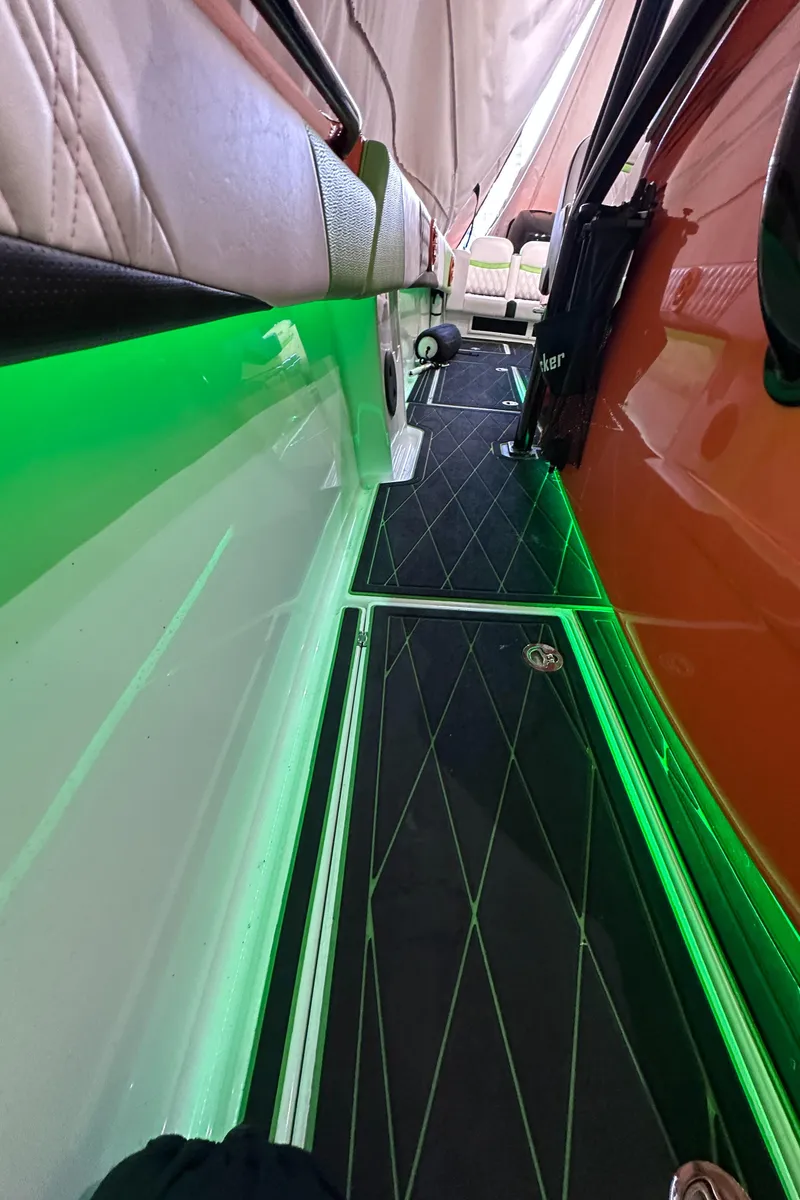 Slide: The Image of 2017 Statement 350 Open boat interior with green LED lighting and sleek design. - 26