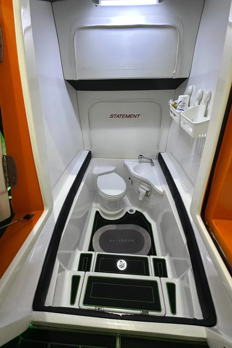 Slide: The Image of Interior of 2017 Statement 350 Open boat, featuring a compact, modern bathroom design. - 27