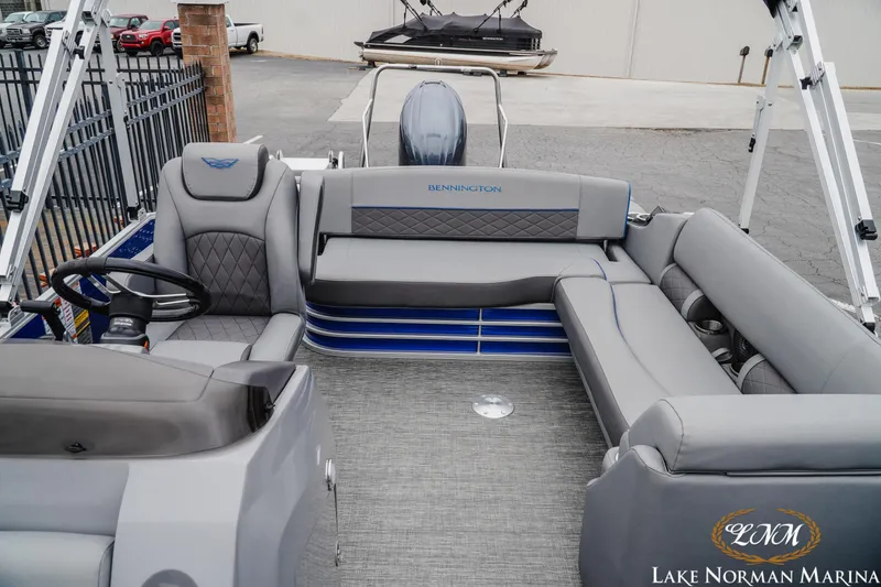 Slide: The Image of 2024 Bennington 23LSB pontoon boat interior with gray seating at Lake Norman Marina. - 12